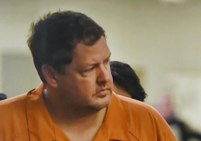 FILE - In this Sunday, Nov. 6, 2016, file photo, Todd Kohlhepp's enters the courtroom of Judge Jimmy Henson for a bond hearing at the Spartanburg Detention Facility in Spartanburg, S.C. A South Carolina woman who spent two months chained inside a metal container says her captor bragged that he was good at killing people and warned her she could be next if she fought back or ran. Brown and her boyfriend had been missing since Aug. 31, when they went to Kohlhepp's rural property, thinking they were going to clear underbrush. (AP Photo/Richard Shiro, File)