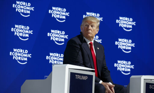 President Donald Trump listens as he is introduced to deliver a speech to the World Economic Forum, Friday, Jan. 26, 2018, in Davos. (AP Photo/Evan Vucci)